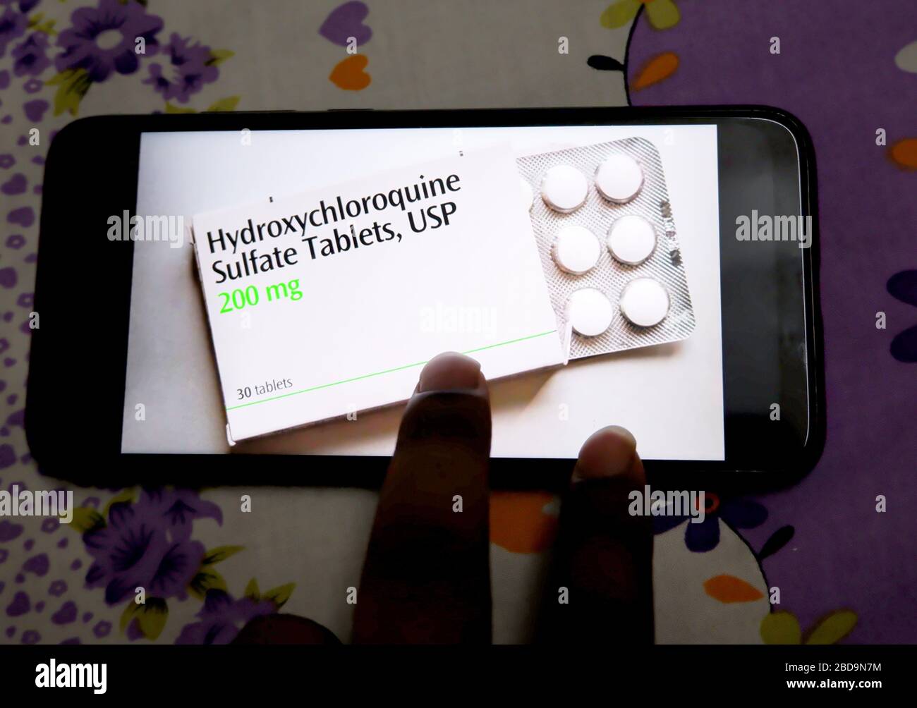 In this photo illustration Hydroxychloroquine Tablet logo seen displayed on a smartphone. Stock Photo