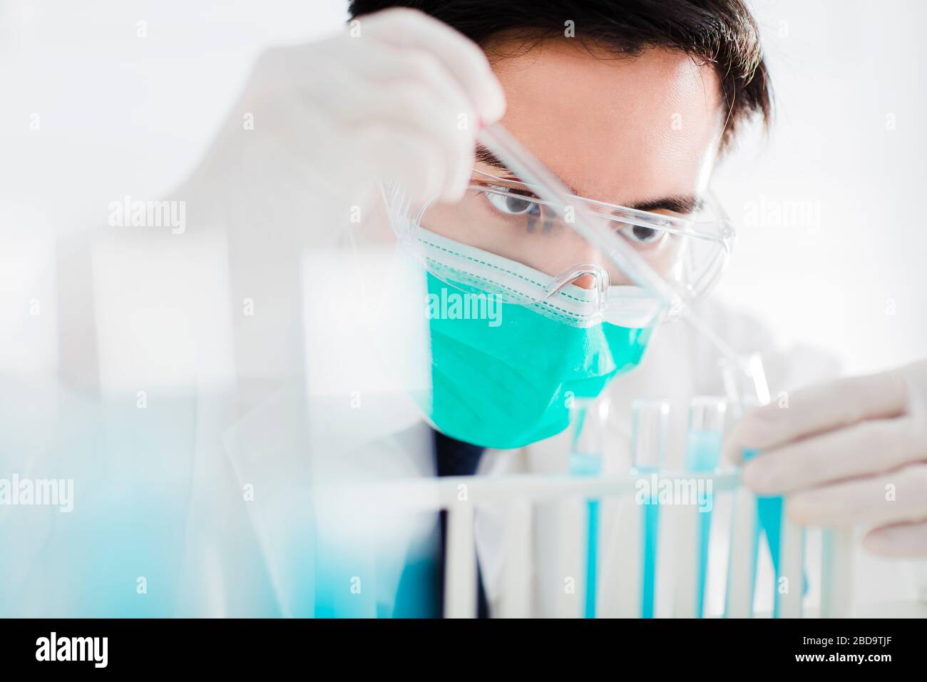 scientist in the laboratory working at lab with test tubes Stock Photo