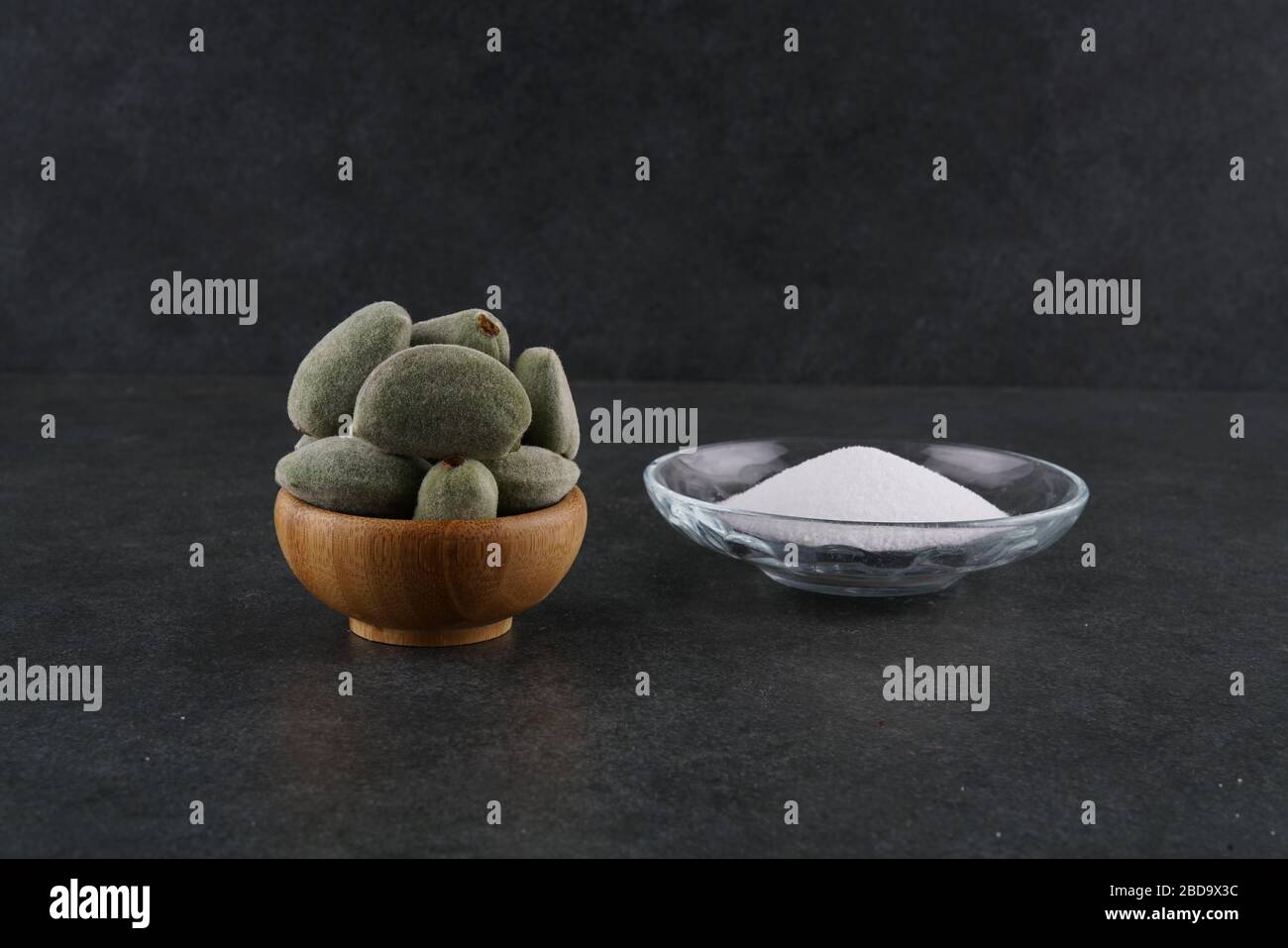 Unripe fresh almond on dark background Stock Photo