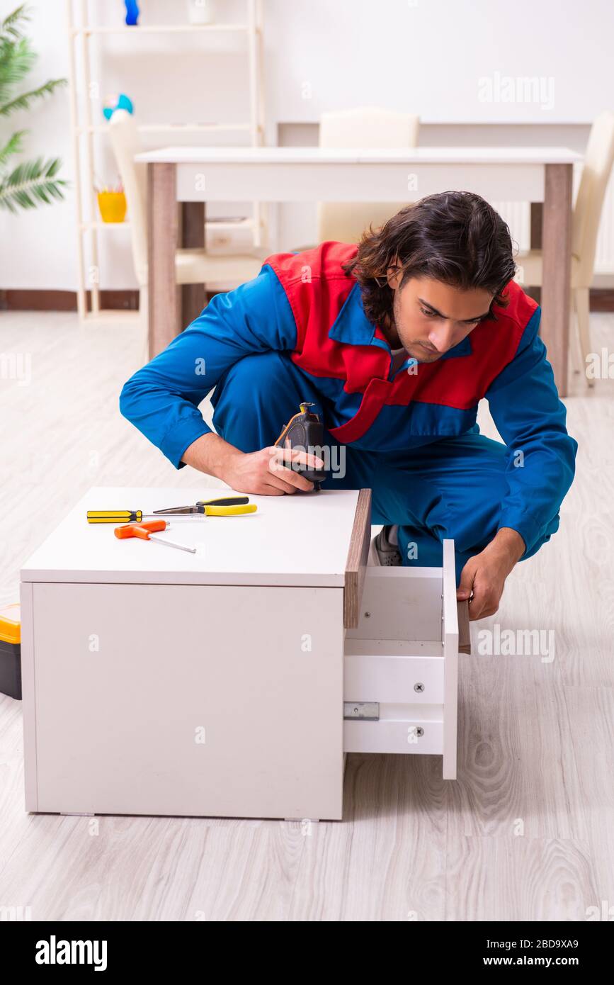 Carpentry Assembly Young carpenter working assembling furniture Stock Photo - Alamy