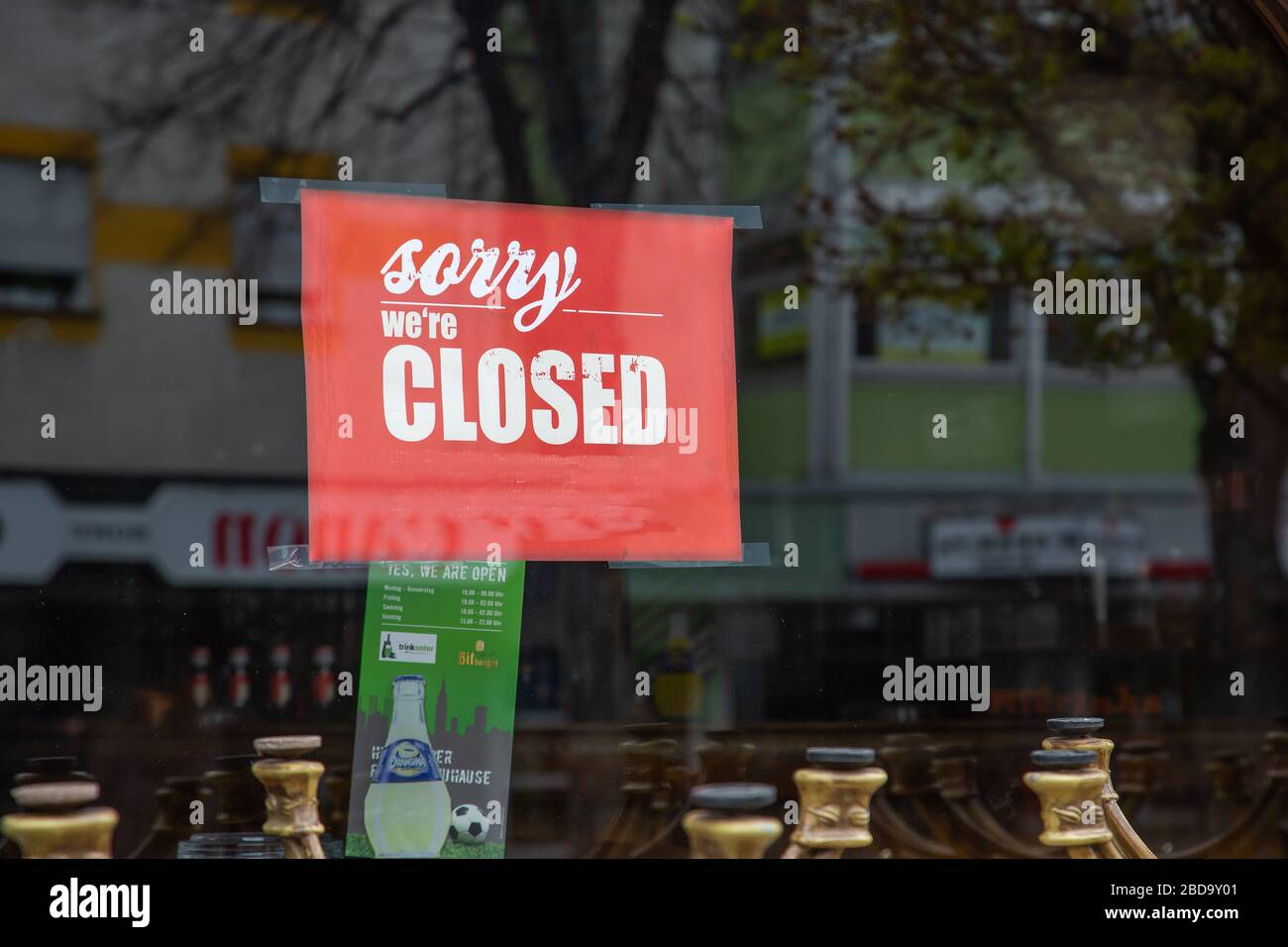 Neuwied, Germany - April 3, 2020: indicating label 'Sorry, we're closed' in the window of a closed pub based on Corona pandemic Stock Photo