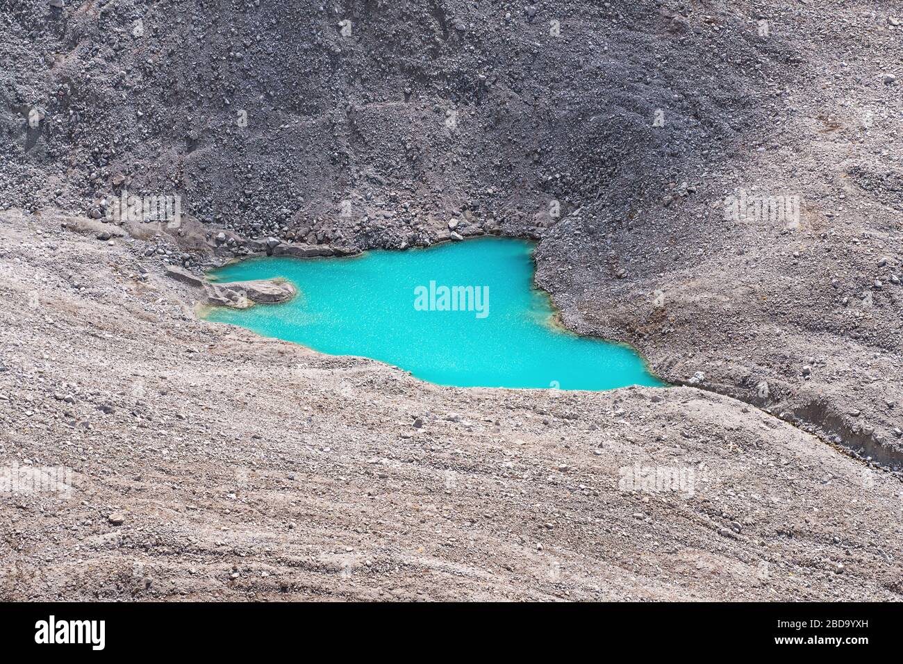 Turquoise water of moraine lake in the highlands; beginning of the river, purity of water resources Stock Photo