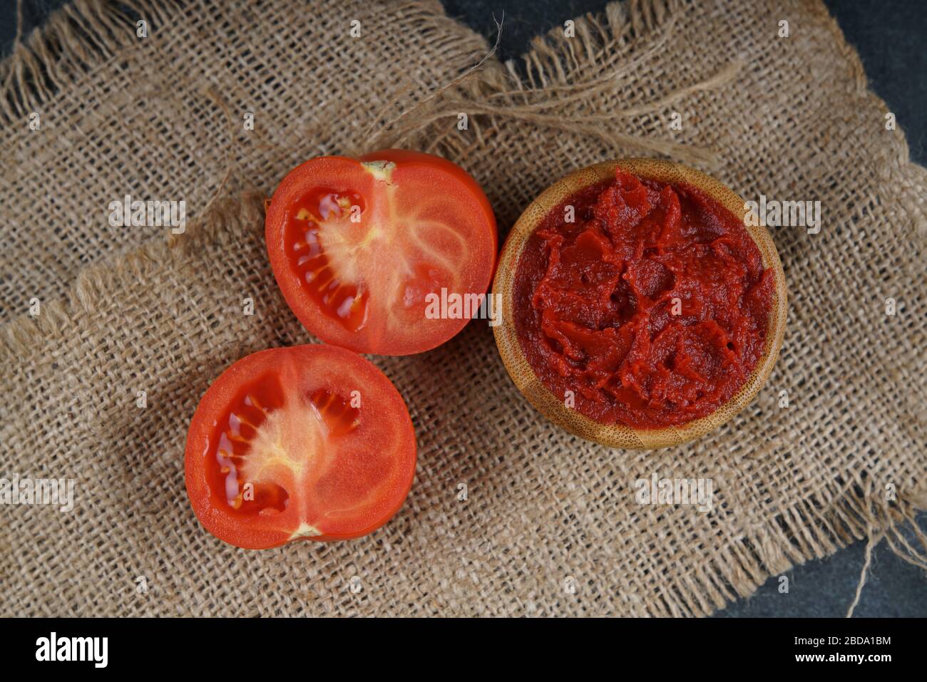 Tomato on dark background Stock Photo