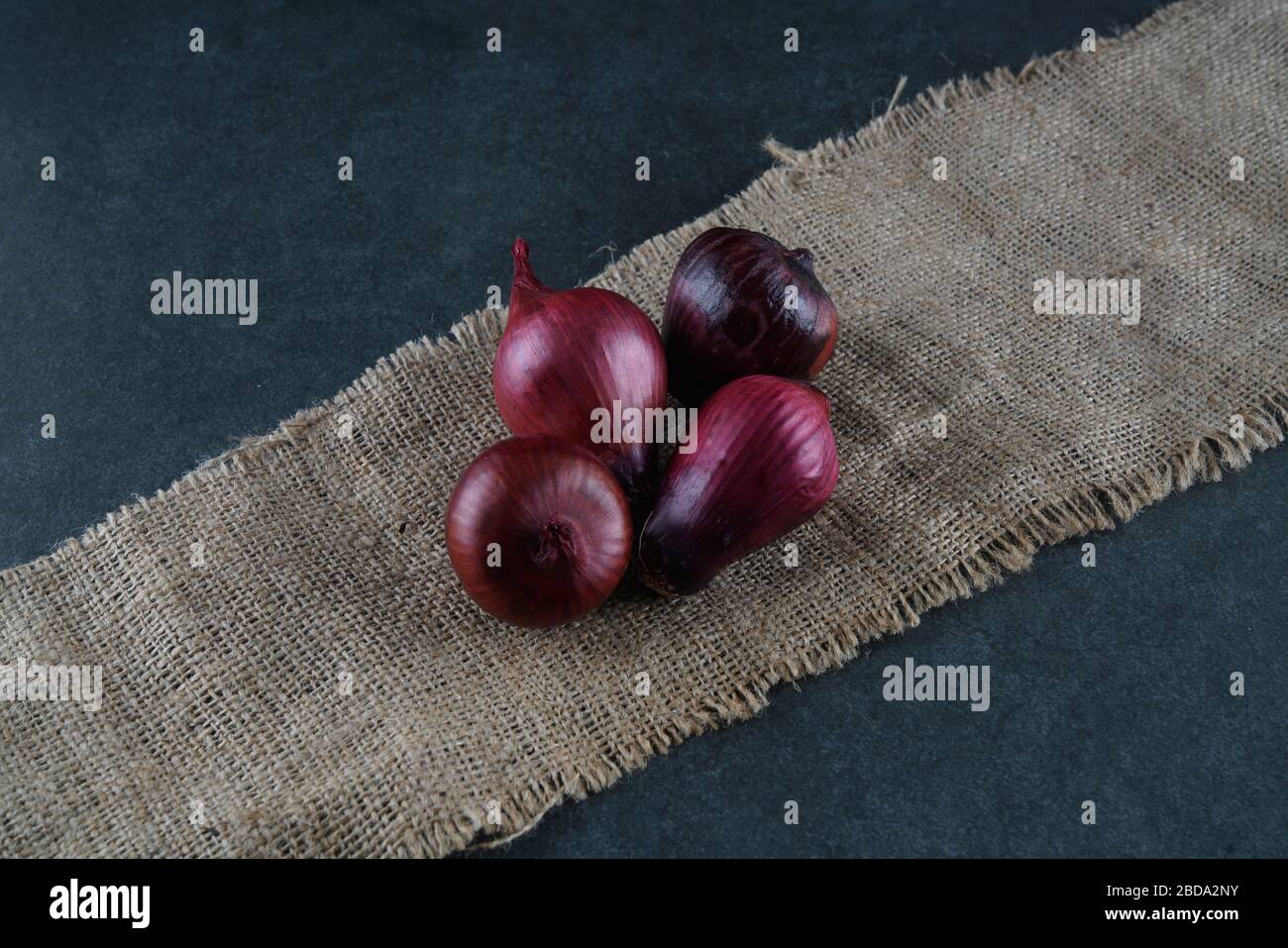 Red onion on dark background Stock Photo