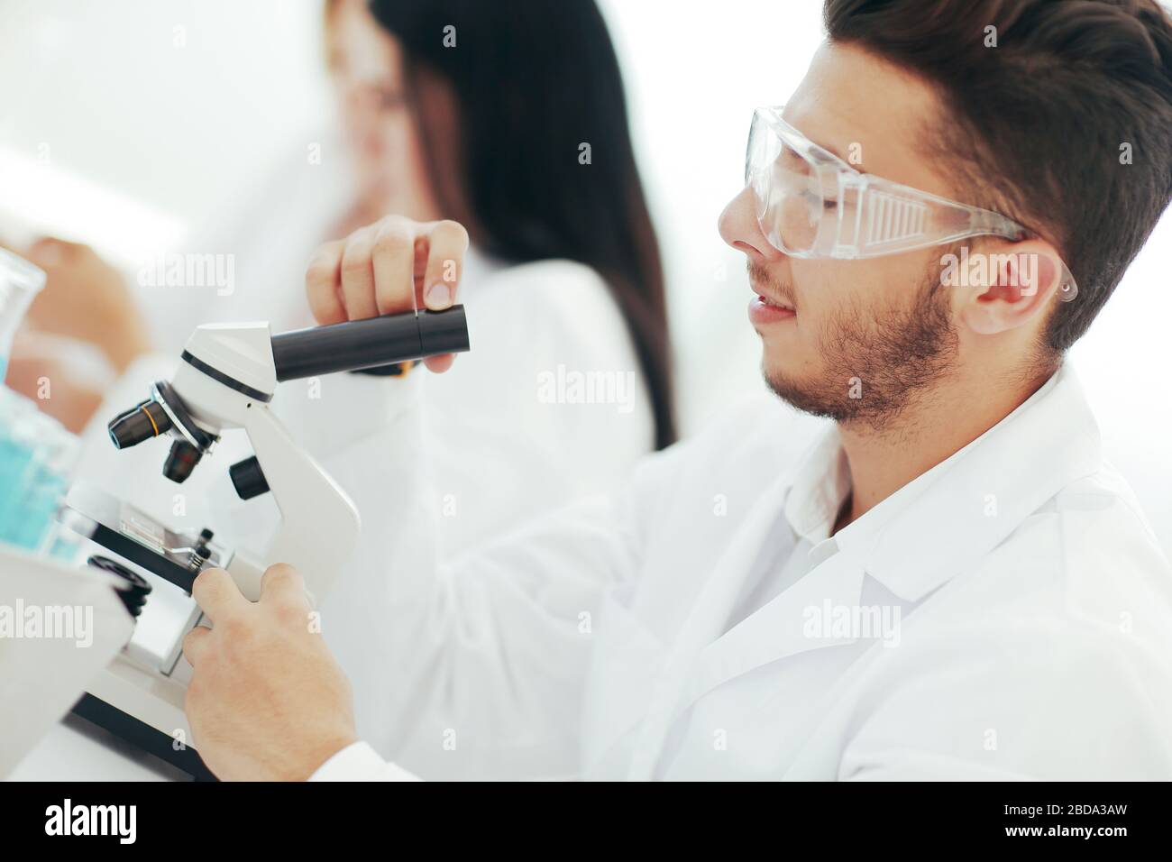 close up.man scientist looking through a microscope Stock Photo