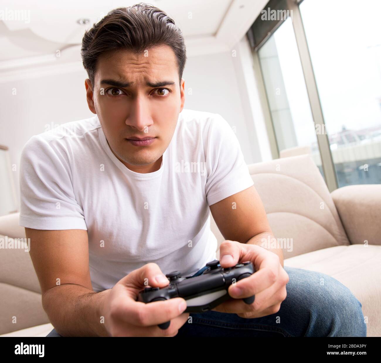 The Man Addicted To Computer Games Stock Photo Alamy
