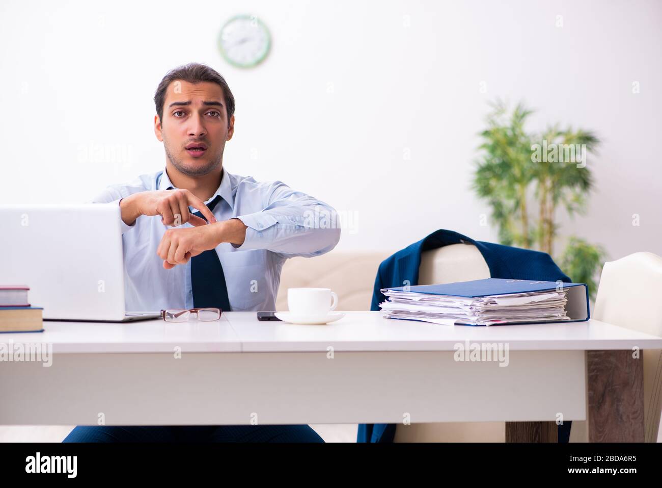 Young employee working from house Stock Photo