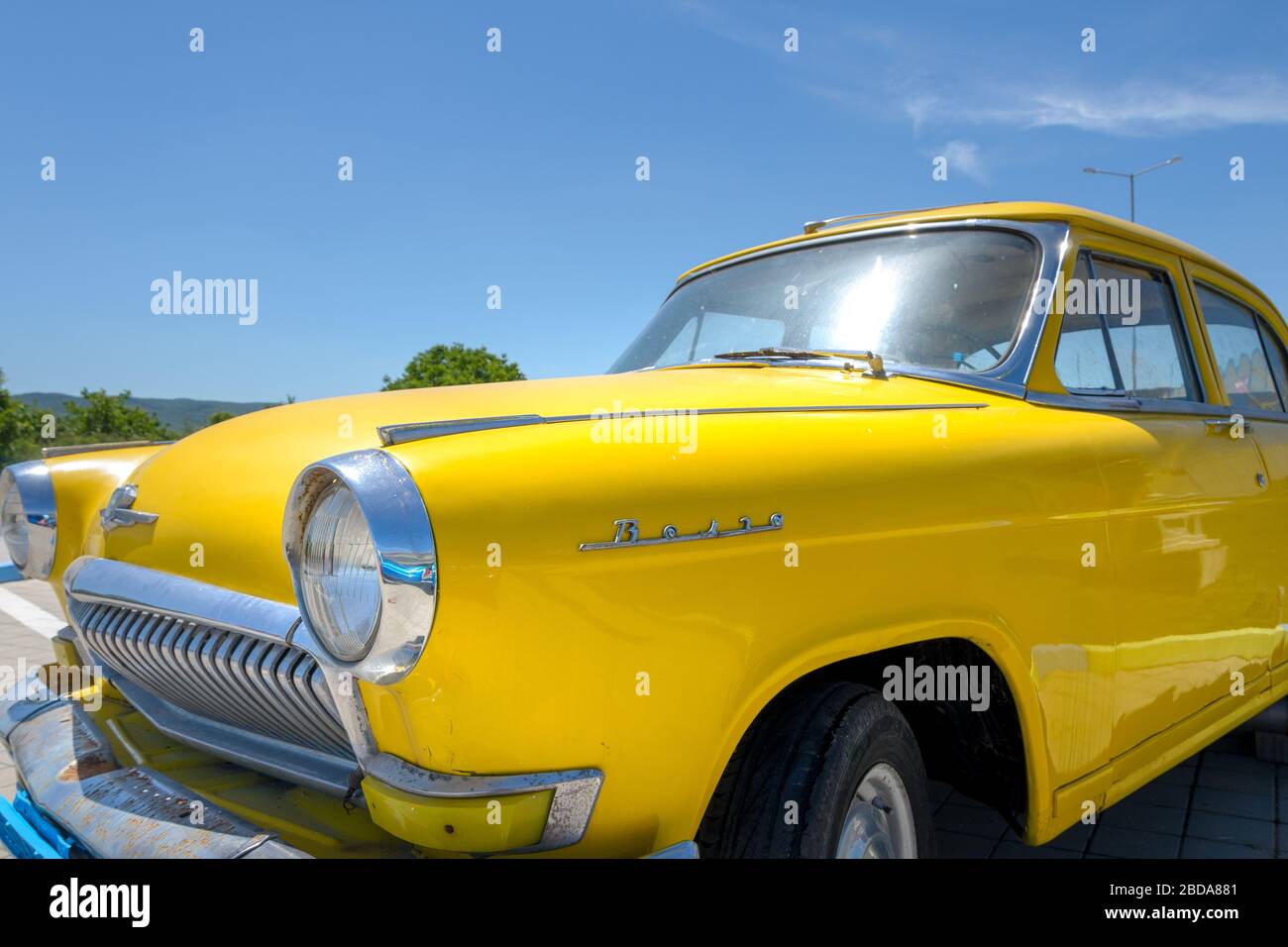 Close up of a yellow classic Russian Gaz Volga car (Gorky Automobile factory) Bulgaria Stock Photo