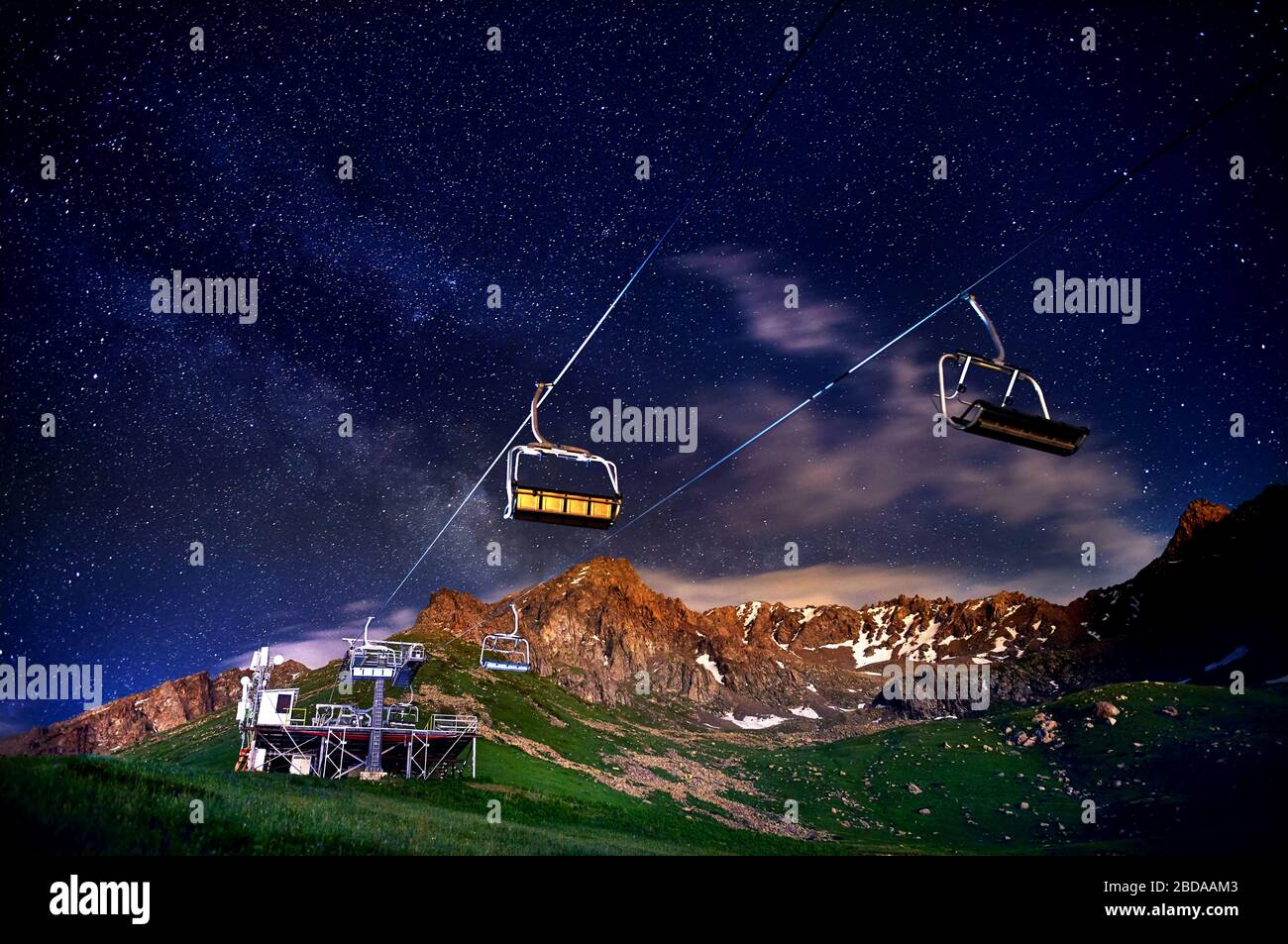 Cable car station at the mountain ski resort with starry night sky Stock Photo