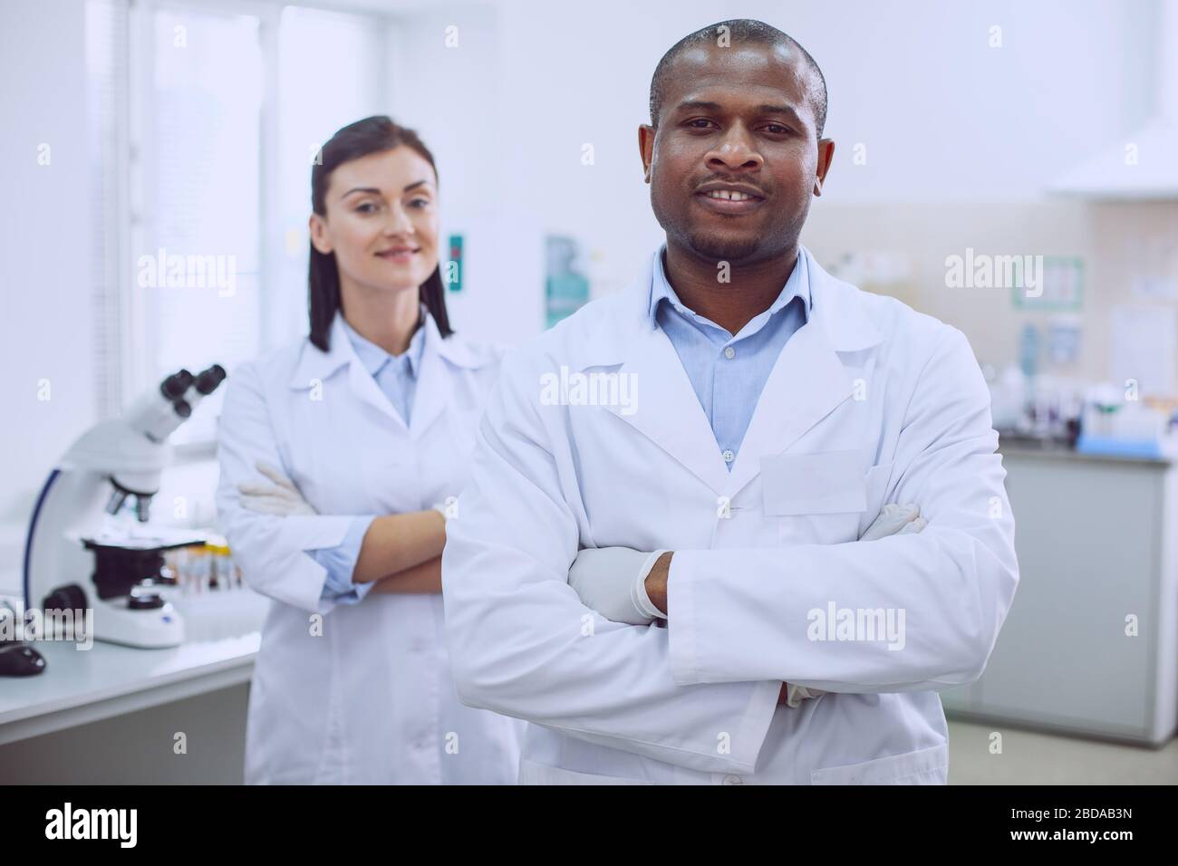 Cheerful biologists standing together in the lab Stock Photo