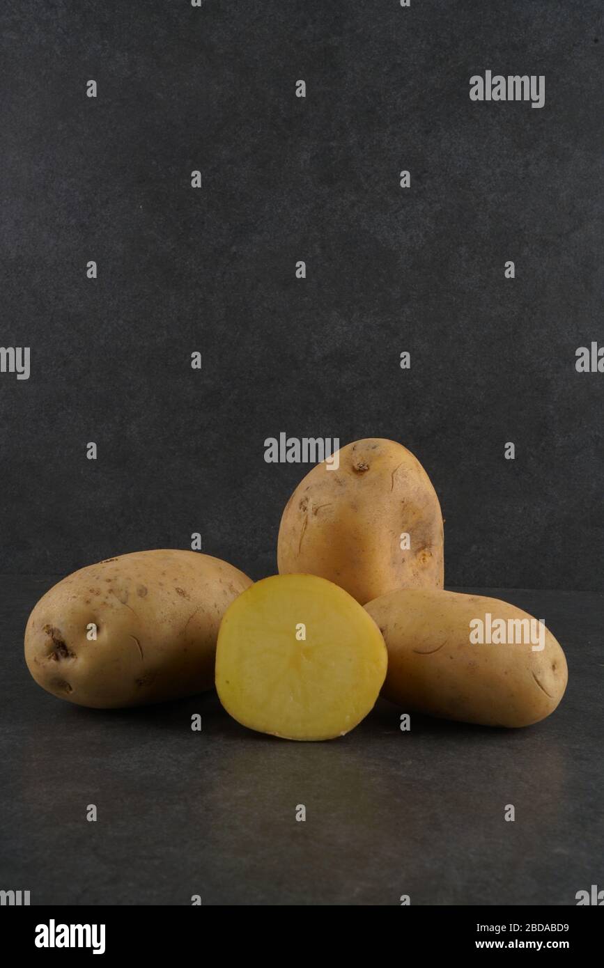 Fresh patato on dark background Stock Photo