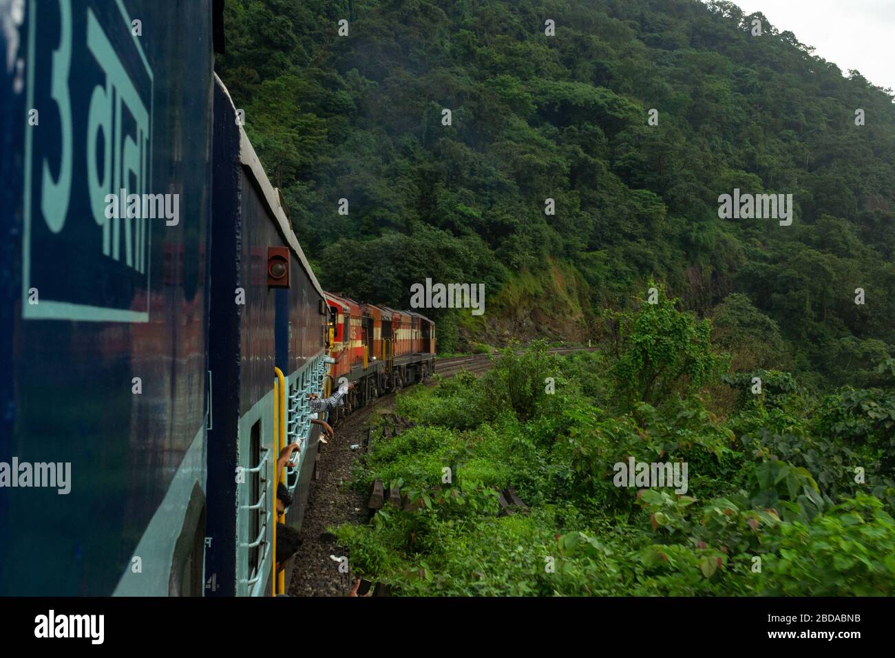 Banking engines helping the train climb the gradient of Braganza Ghat section of Indian Railways Stock Photo