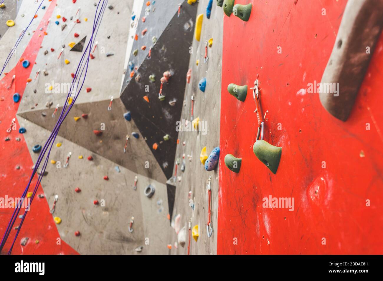 steep rock, climbing on artificial wall indoors. Extreme sports and