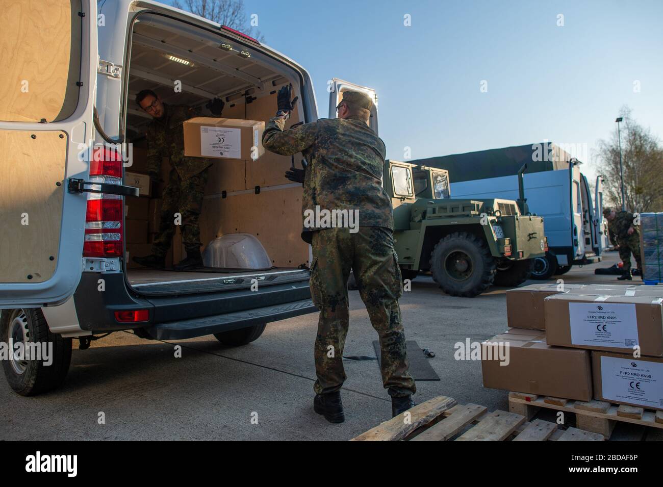 Burg, Germany. 08th Apr, 2020. Soldiers of the Logistics Battalion 171 load their vehicles on the grounds of the Clausewitz Barracks with rifle equipment packed in packages. From Burg, the soldiers distribute the protective equipment to the districts. The protective equipment includes masks, disposable gloves, protective gowns, sterile suits and hand and surface disinfectants. During the course of the day, each district is equipped with 20,000 surgical masks and 40,000 particularly protective filter masks. Credit: Klaus-Dietmar Gabbert/dpa-Zentralbild/ZB/dpa/Alamy Live News Stock Photo