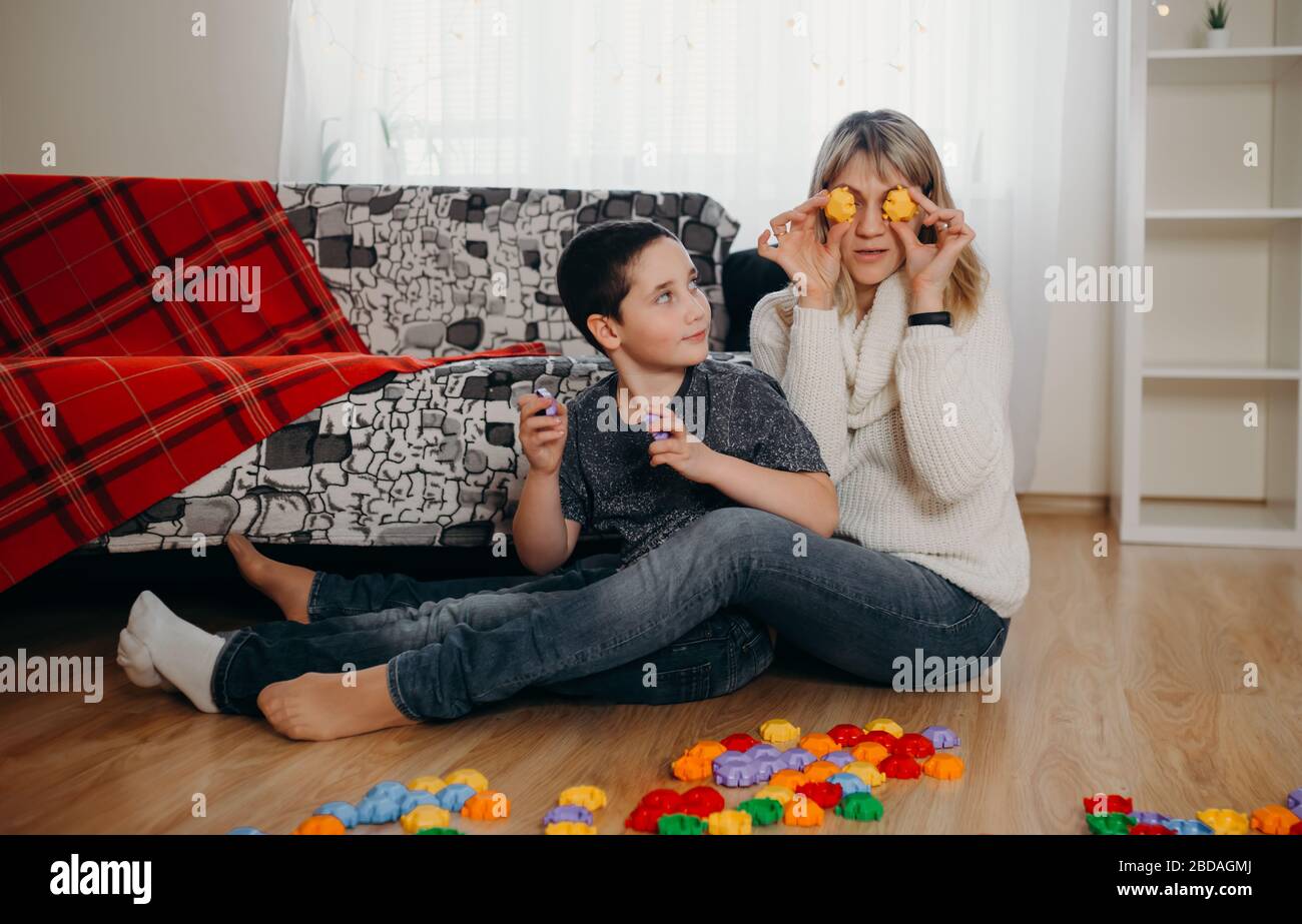 Mother and little boy have fun engaged. Concept of distance education Stock Photo