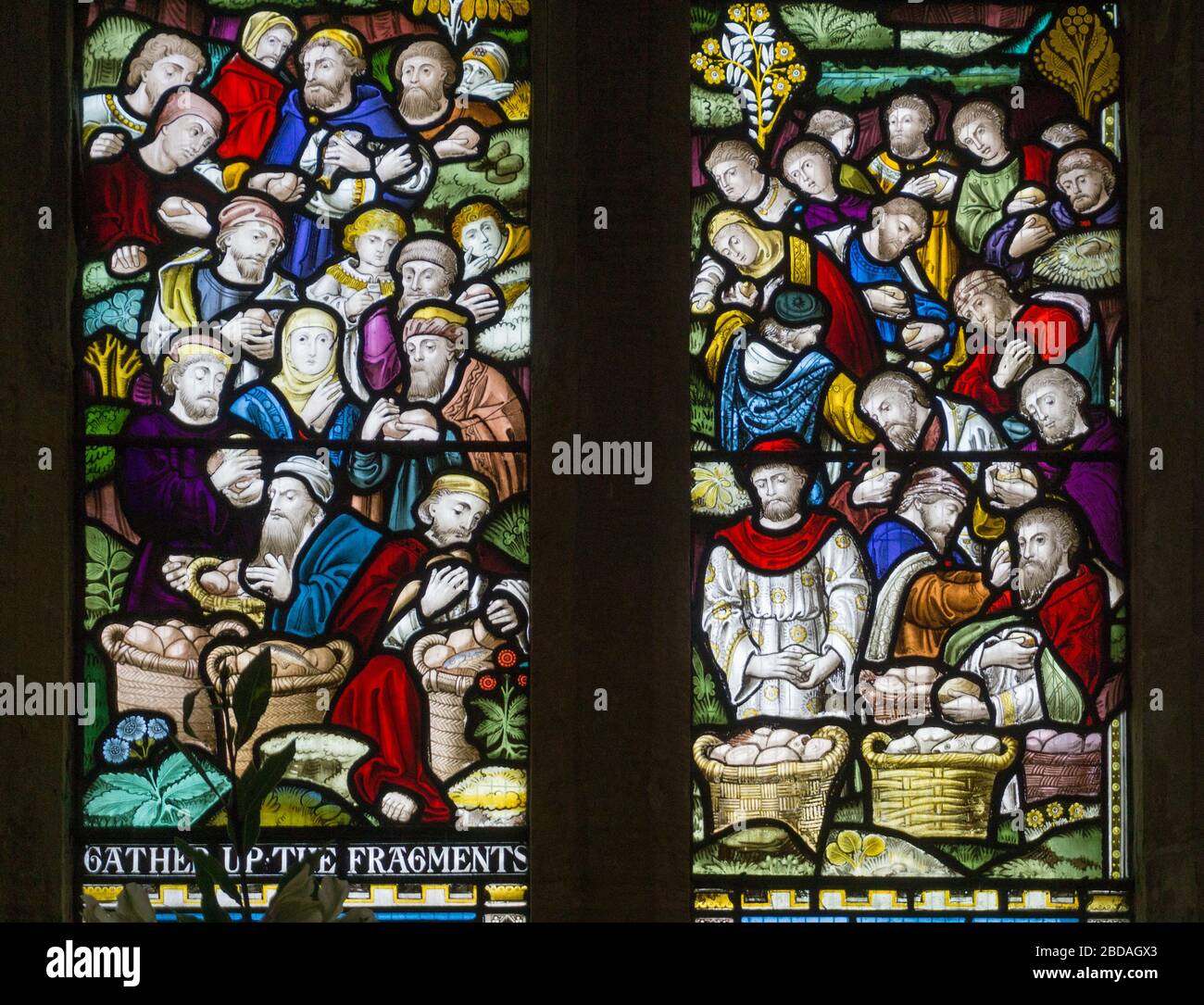 Stained glass window depicting a biblical scene, St James church, Paulerspury, Northamptonshire, UK Stock Photo