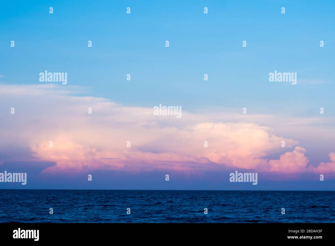 Pink clouds and sunset sky over sea Stock Photo - Alamy