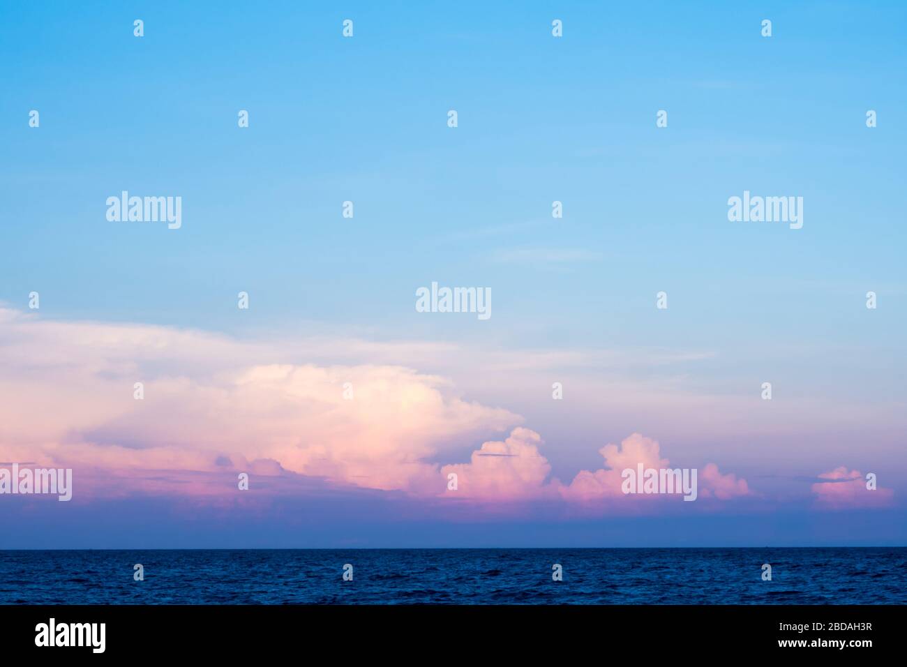 Pink clouds and sunset sky over sea Stock Photo - Alamy