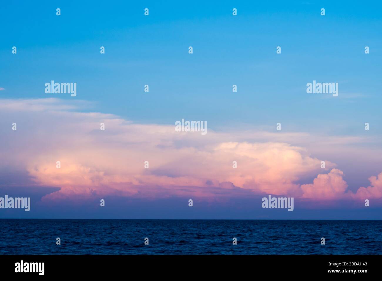 Pink clouds and sunset sky over sea Stock Photo - Alamy