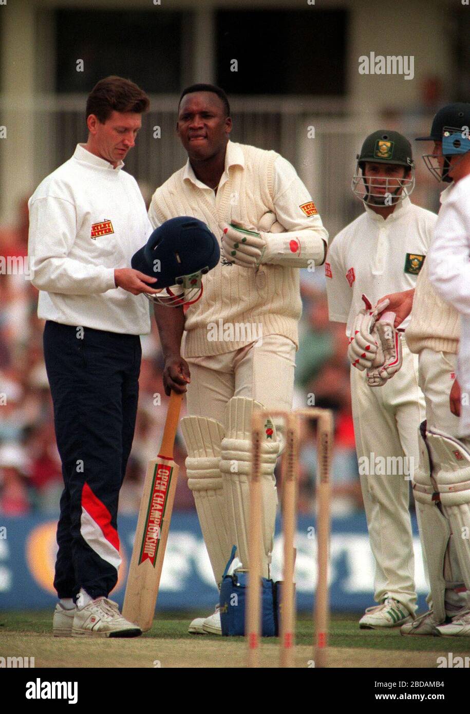 File photo dated 20-08-1994 of England v South Africa Test Match England's Devon Malcolm grimaces after receiving a blow on his protective helmet with a bouncer bowled by South Africa's Fanie De Villers. Stock Photo