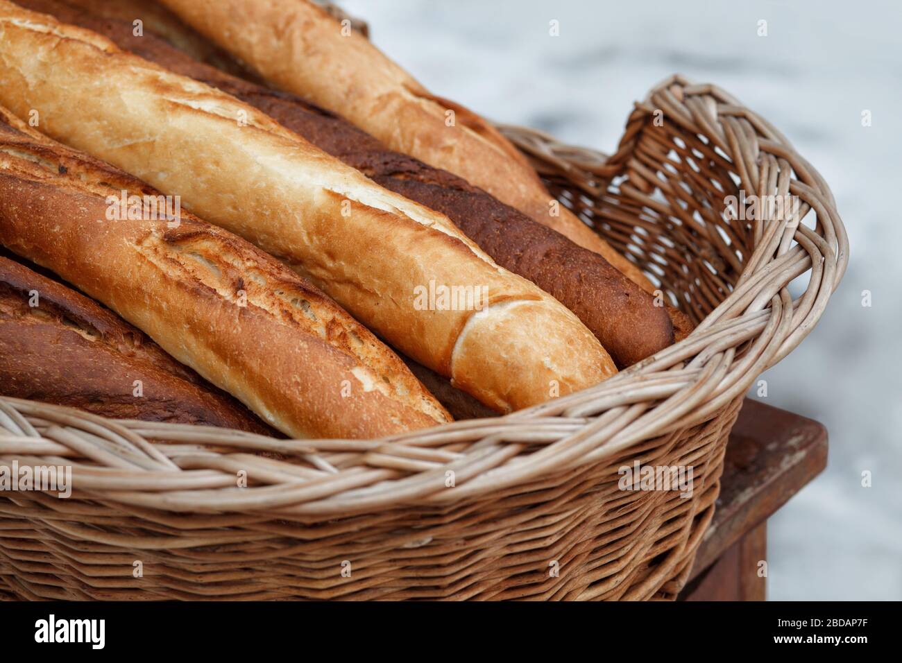 French baguettes in a wicker basket Stock Photo Alamy