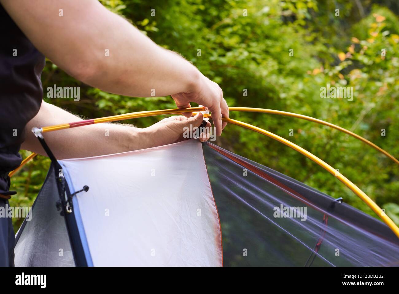 tourists put up a tent in a camping. Step by step guide on how to set ...