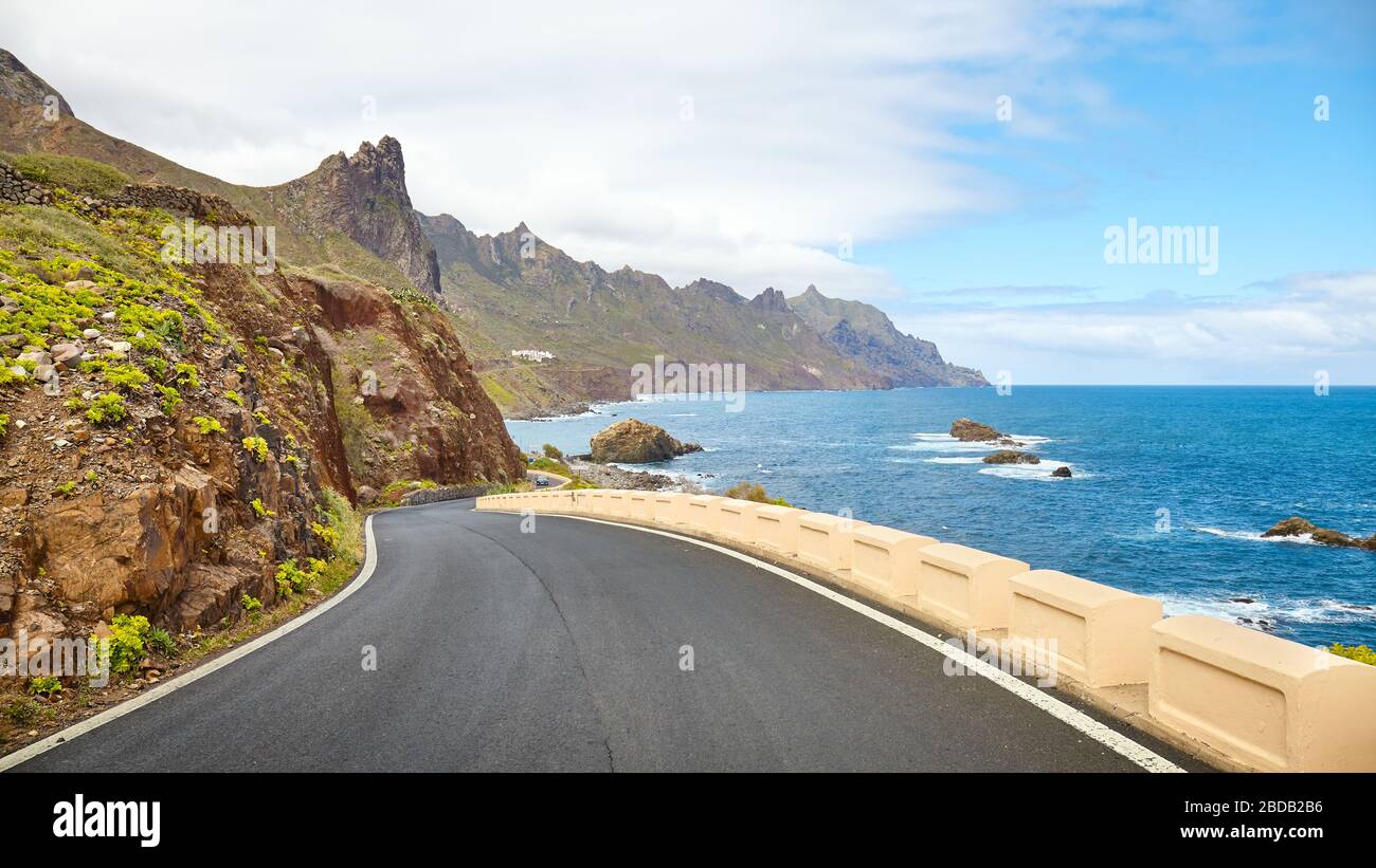 Scenic ocean drive by cliffs of the Macizo de Anaga mountain range, Tenerife, Spain. Stock Photo