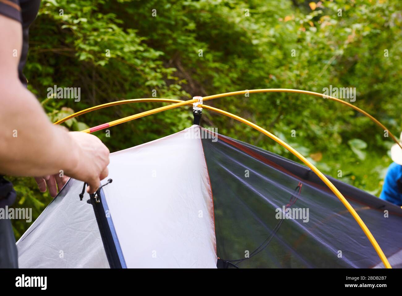 tourists put up a tent in a camping. Step by step guide on how to set ...