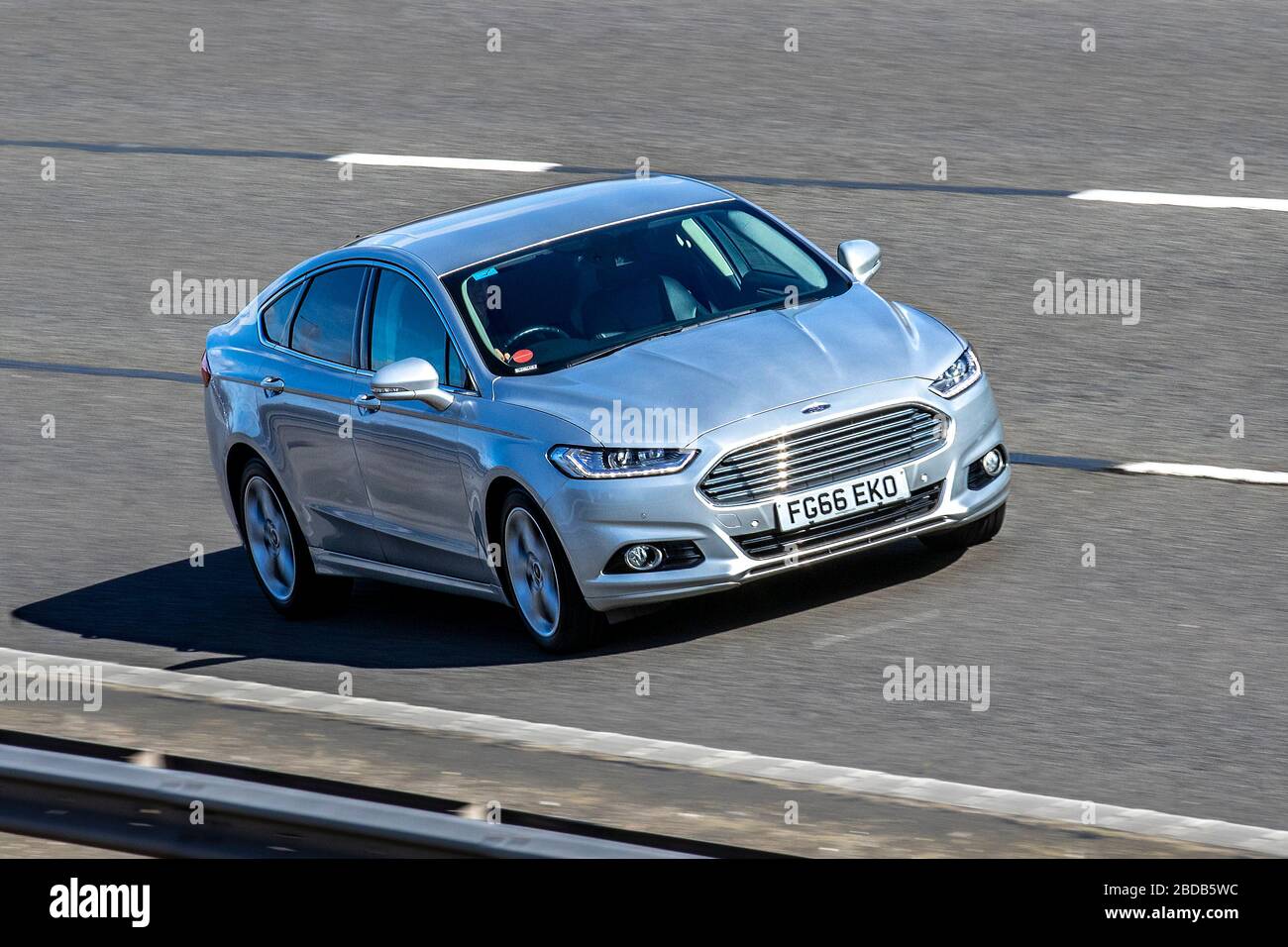 2016 silver Ford Mondeo Titanium TDCI; Vehicular traffic moving vehicles, driving vehicle on UK roads, motors, motoring on the M6 motorway highway Stock Photo