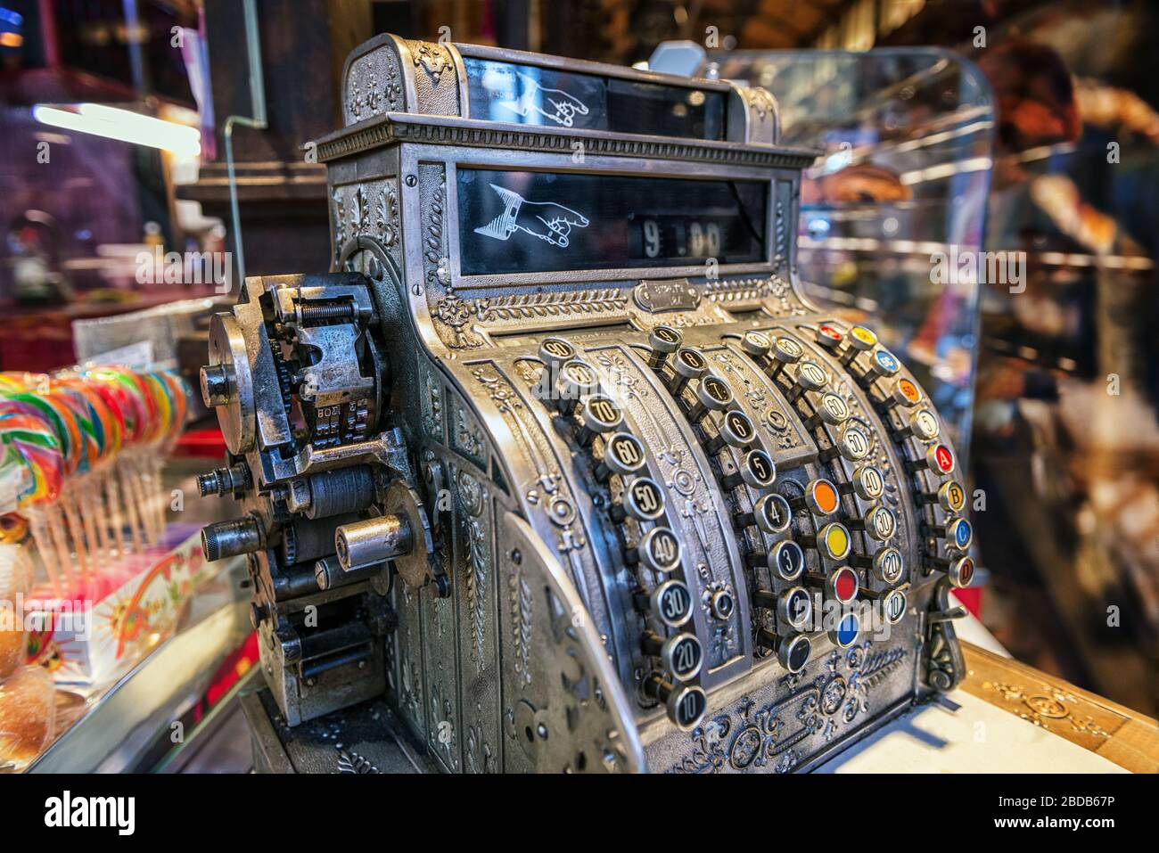Ornate silver antique cash register with selective focus in a sweet candy shop Stock Photo