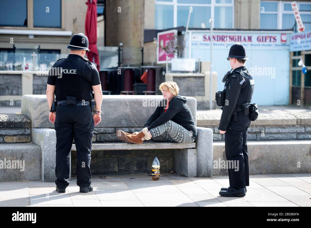 Police instruct a homeless person to return to her accomodation in Weston-super-Mare during the Coronavirus lockdown Stock Photo