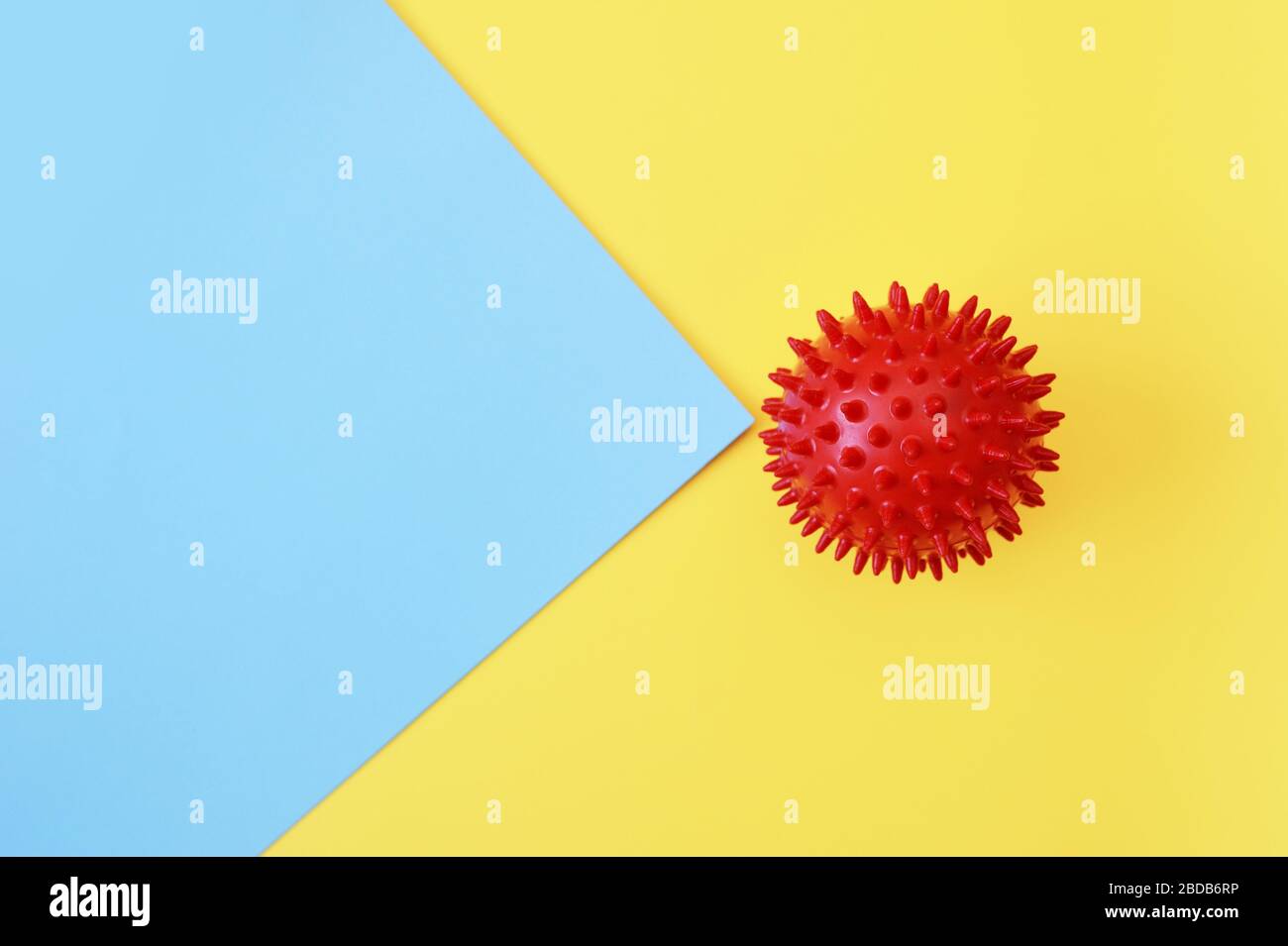 Abstract red ball virus strain model on yellow and blue background. Respiratory syndrome coronavirus and Novel coronavirus covid-19 with place for Stock Photo