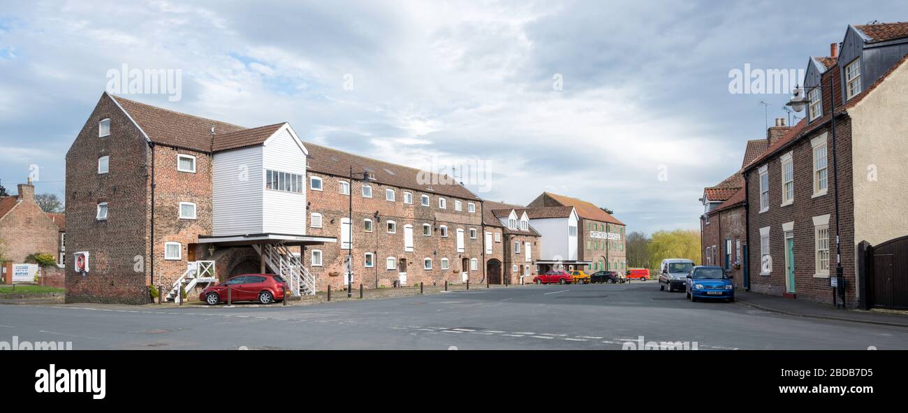 Historic Georgian warehouse buildings now converted into apartments at River Head on the Driffield Navigation, Driffield town, East Yorkshire Stock Photo