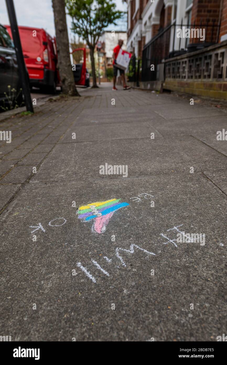 London, UK. 8th Apr 2020. It will be ok - the postman keeps delivering. Anonymous chalk message of hope drawn on a street in Clapham, SW London. Credit: Guy Bell/Alamy Live News Stock Photo