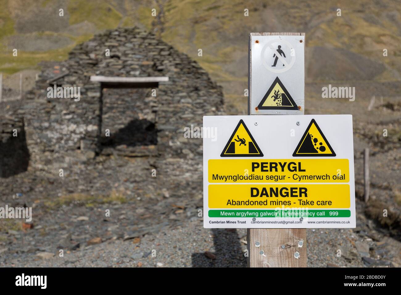 Warning sign at Cwmystwyth mine remains, Wales, UK Stock Photo