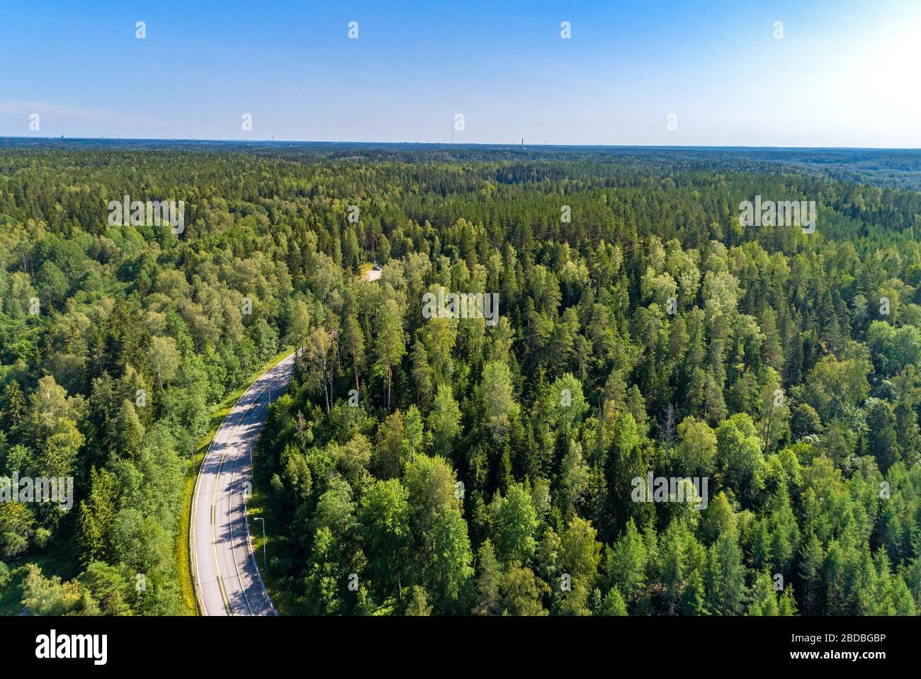 Aerial view of blue lakes and green forests on a sunny summer day in Finland. Stock Photo