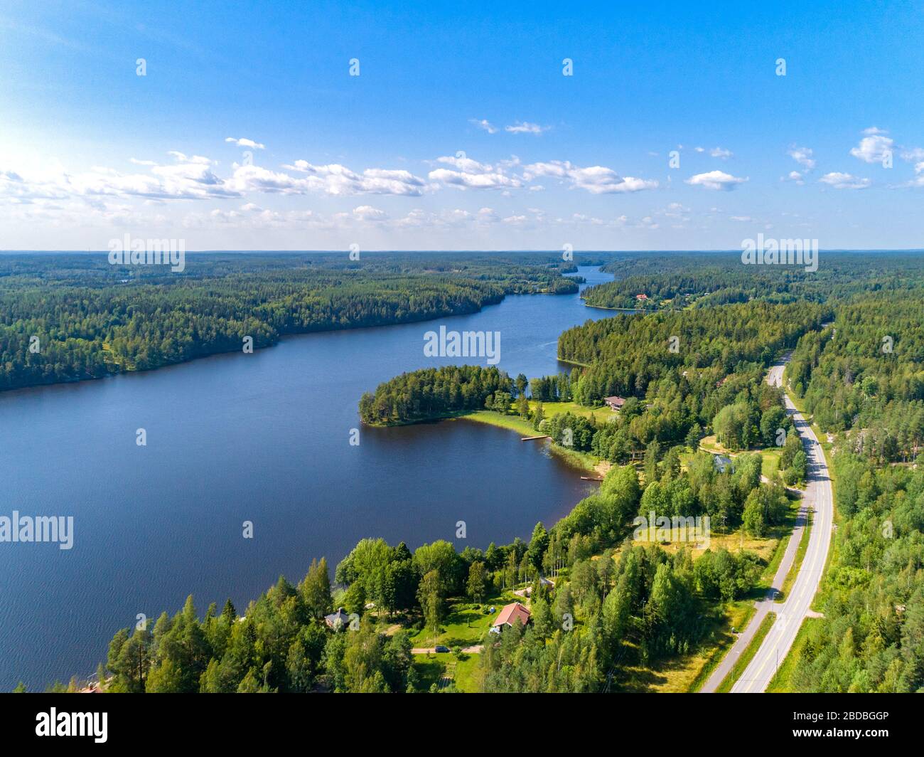 Aerial view of blue lakes and green forests on a sunny summer day in Finland. Stock Photo
