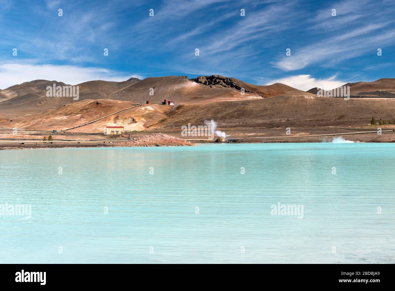 The Blue Lake at Reykjahlíð, near Lake Myvatn, Iceland. Silica-rich heated water, runoff from a geothermal installation in this active volcanic zone Stock Photo
