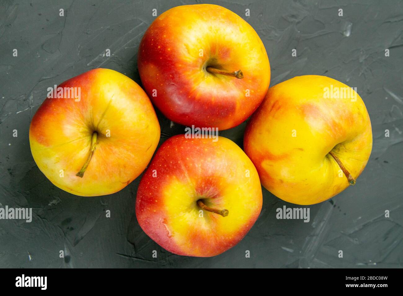 Apples on black stone table background Stock Photo