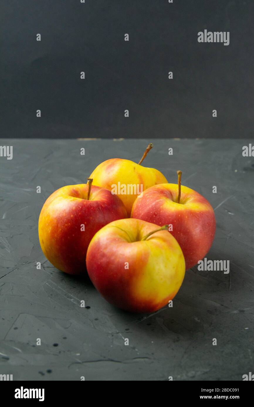 Apples on black stone table background Stock Photo