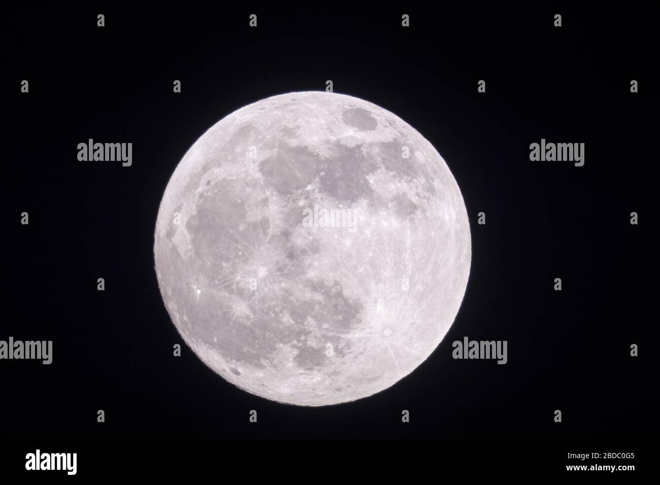 Full moon, fullmoon is shining bright , silver light, close, clear dark winter night, looks close, supermoon, detailed view, January, 2019. Stock Photo