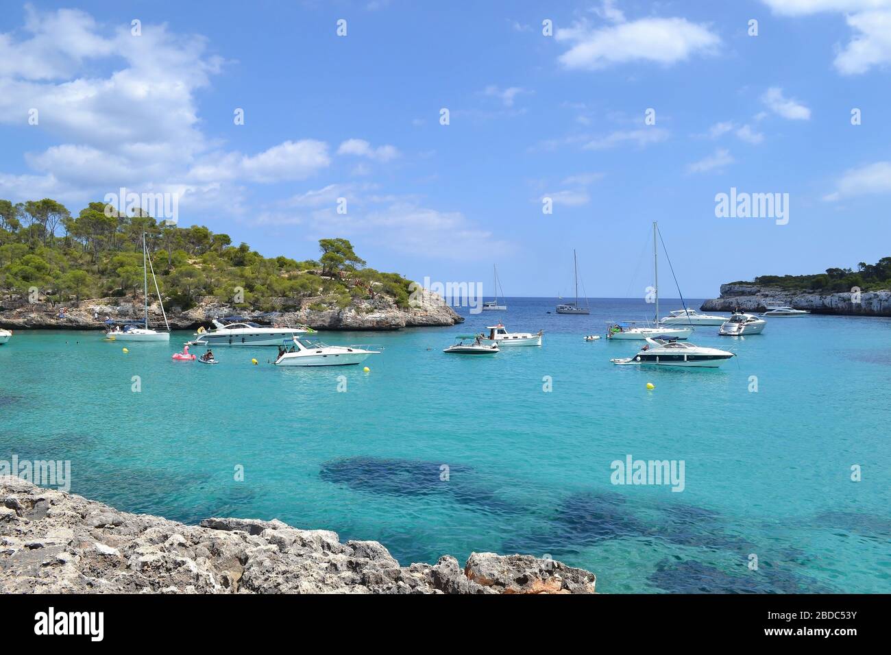 floating boats on turquoise water Stock Photo
