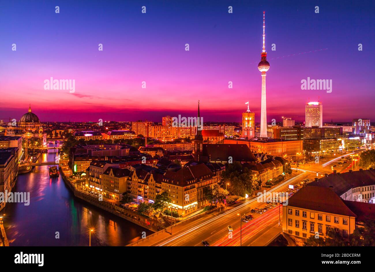 aerial view of Berlin skyline with famous TV tower and Spree river in beautiful post sunset twilight during blue hour at dusk with dramatic sky. Stock Photo