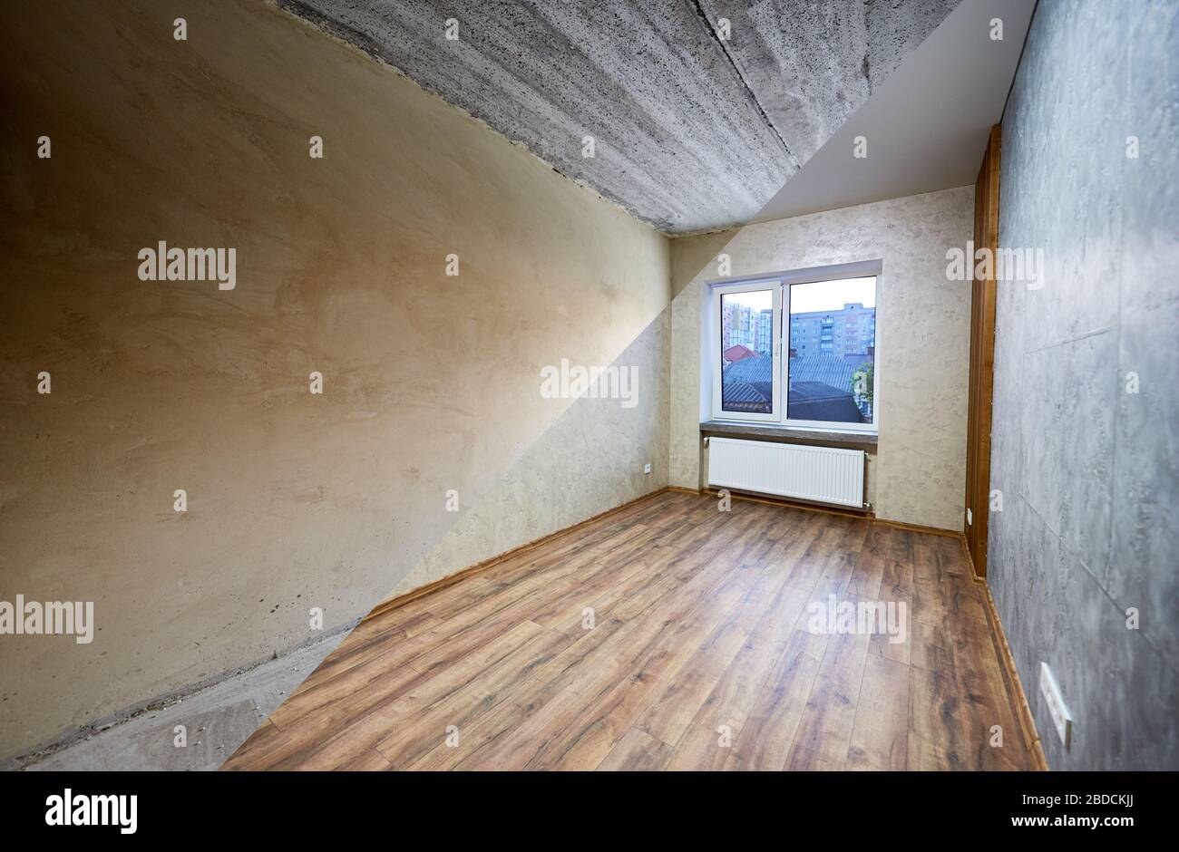 Room in apartment before and after renovation works, new window and a radiator, grey wallpapers and wood textured laminate, renovation concept Stock Photo