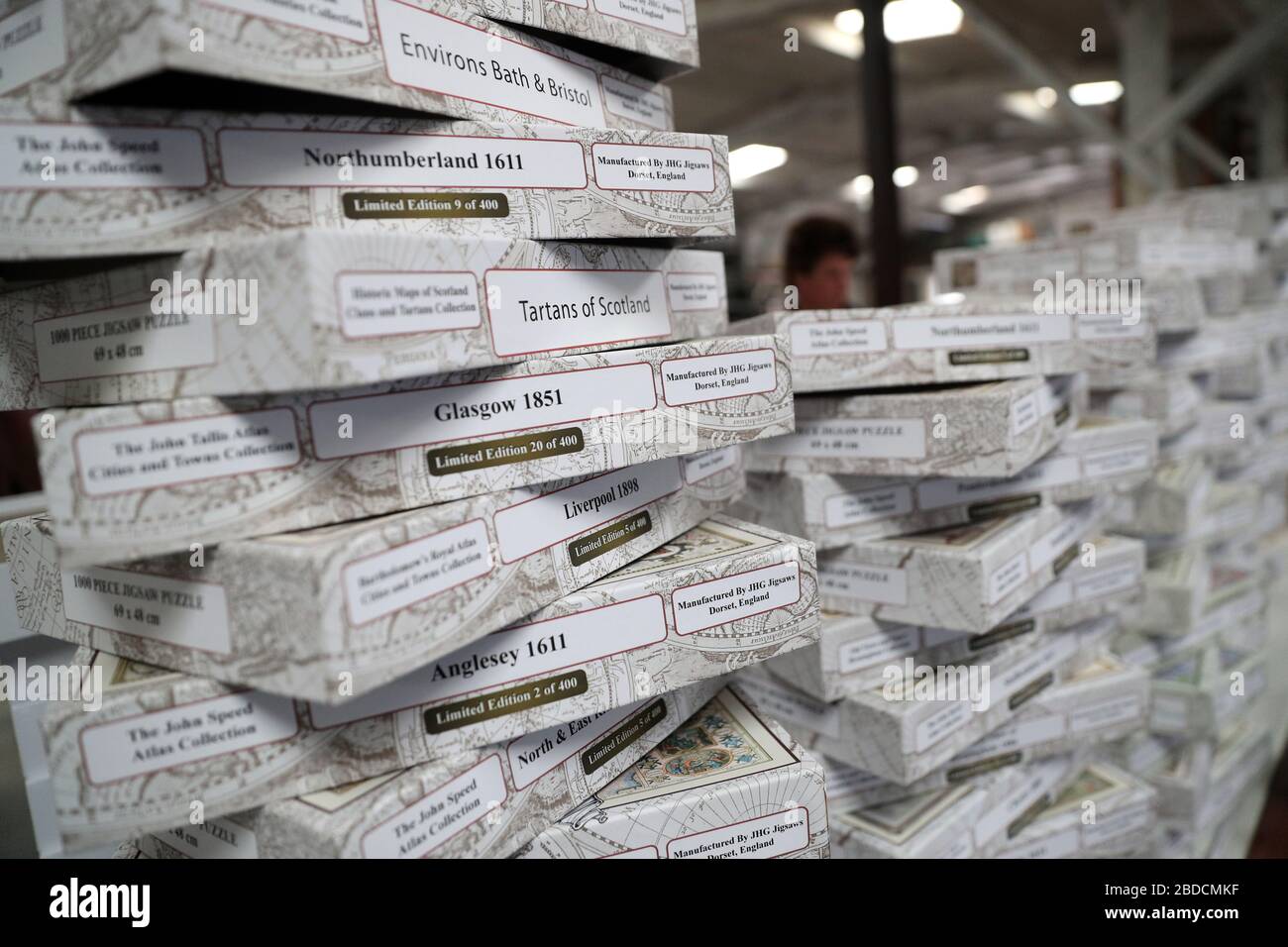 Jigsaw boxes are stacked up after being filled with cut pieces at JHG