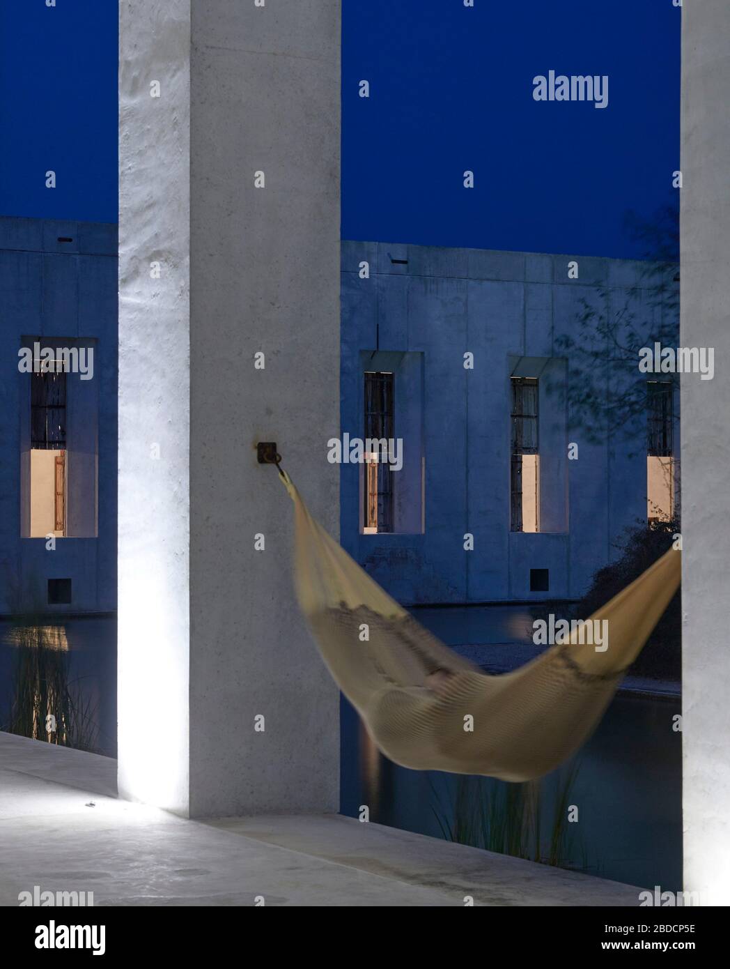 Hammock in colonnade. Plantel Matilde, Yucatan, Mexico. Architect: Javier Marín and Arcadio Marín, 2020. Stock Photo