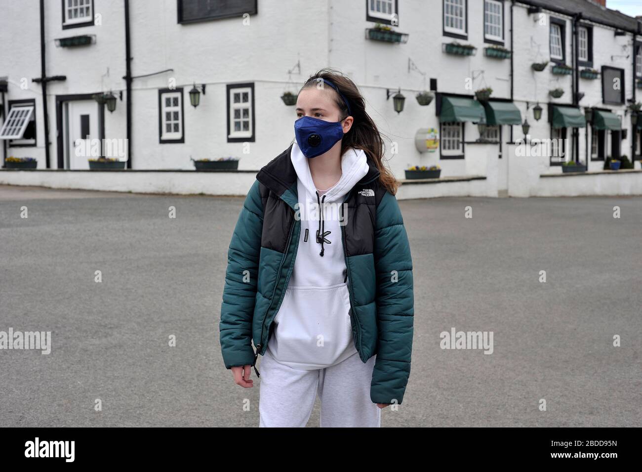 Young teenage girl wearing mask during coronavirus outbreak Stock Photo