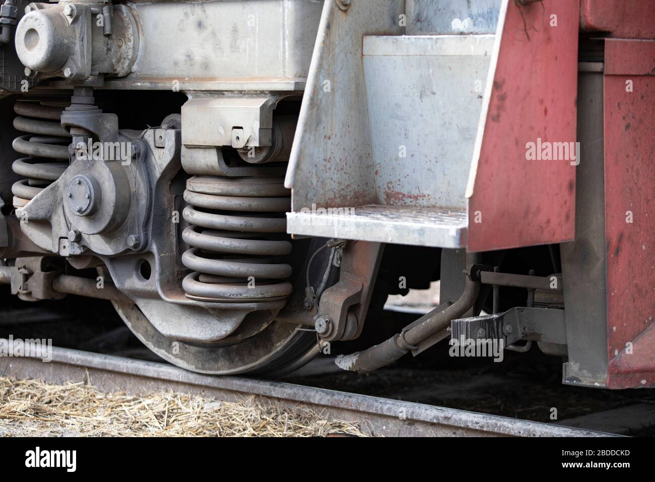 Low angle view of wheel mechanism of modern train on tracks