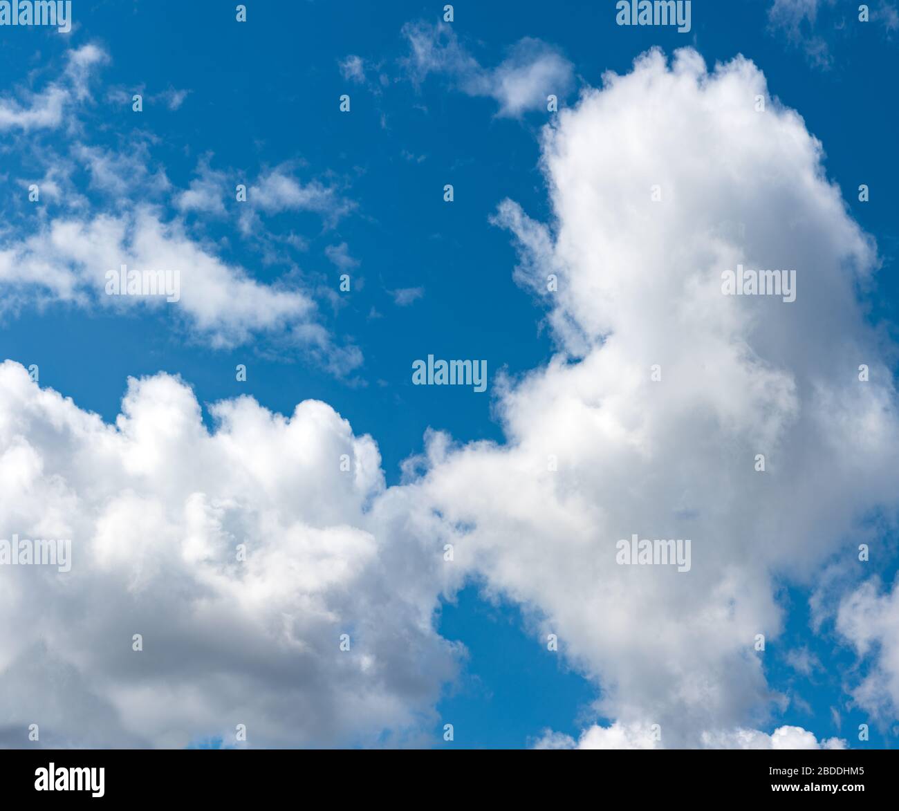 Fluffy clouds in the blue sky Stock Photo - Alamy
