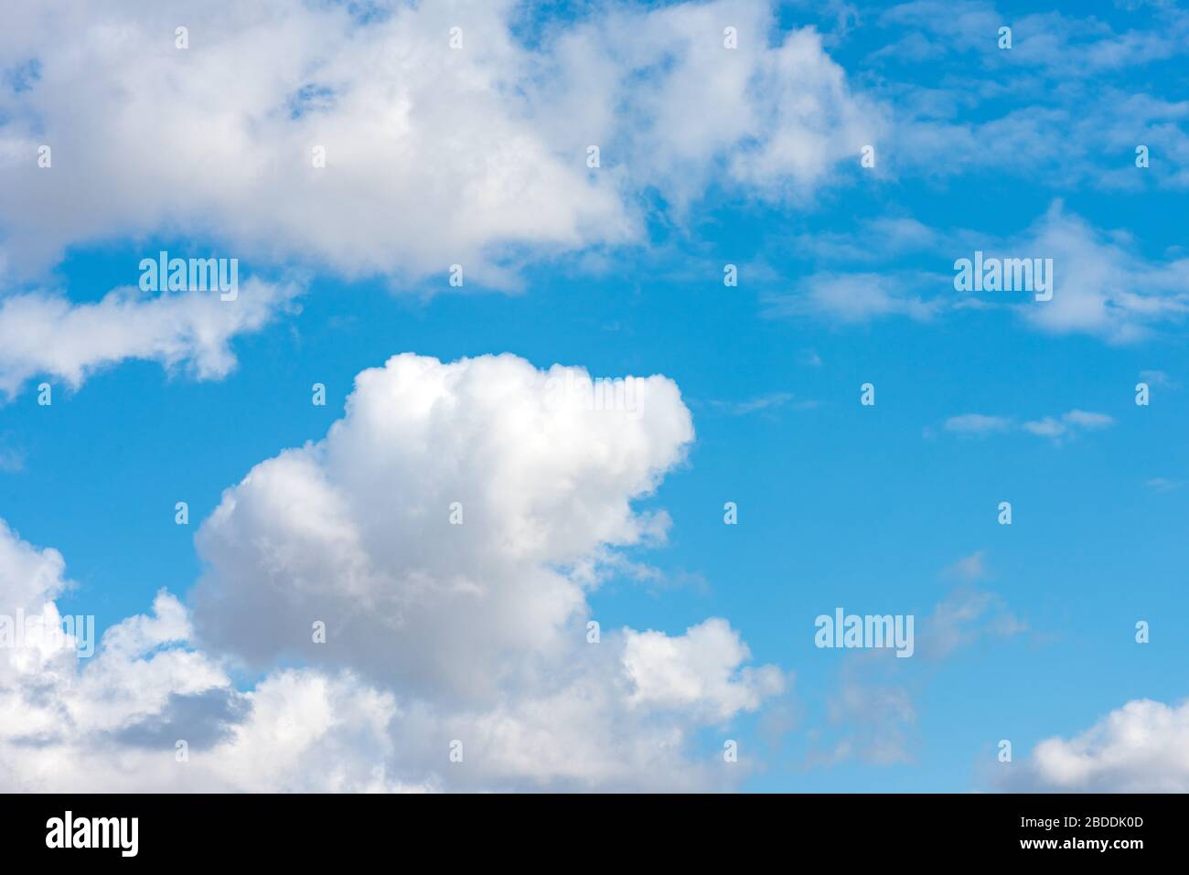 Fluffy clouds in the blue sky Stock Photo - Alamy